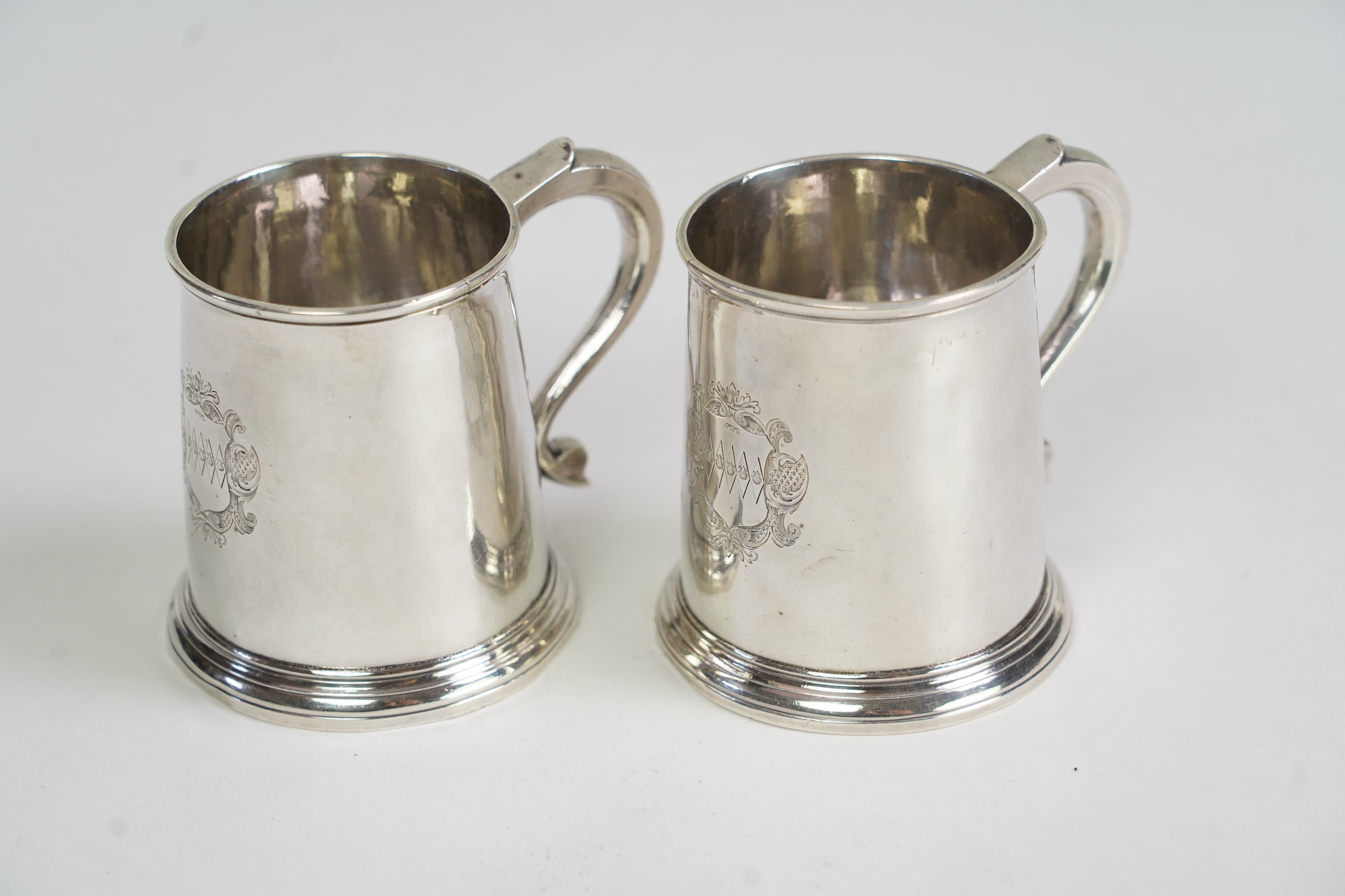 A pair of George I silver small mugs, by Thomas Morse